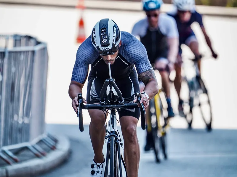 Bruno cycling in lead position during a triathlon race